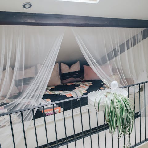 Curl up with a book in the attic's cosy reading nook