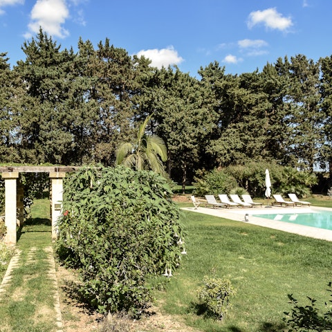 Enjoy a walk around the gardens before a dip in the pool