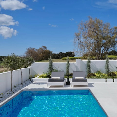 Soak up the sun beside the private pools