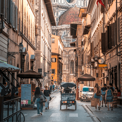 Soak up the city buzz while wandering to the Duomo