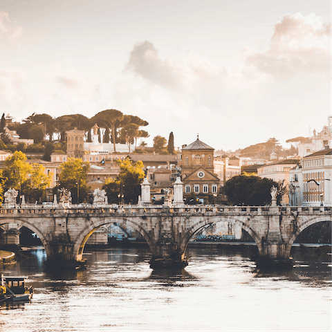 Wander through Rome's winding streets for fifteen minutes until you reach the famous banks of the River Tiber