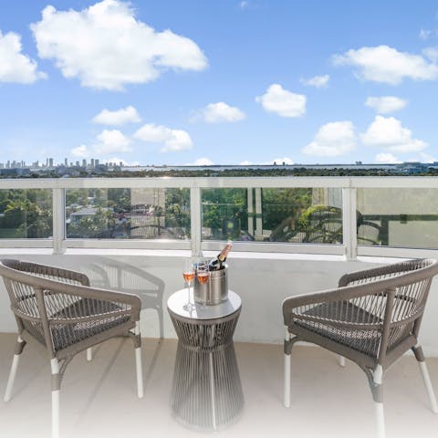 Pop open the bubbly while unwinding on your private balcony