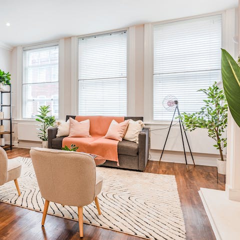 Plan the day's sightseeing itinerary in the light-filled living room