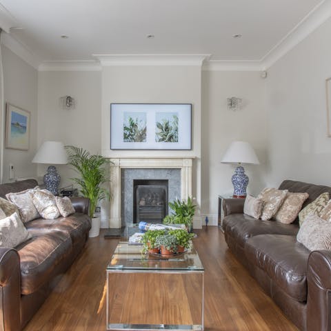 Unwind on plush leather couches after a day on your feet