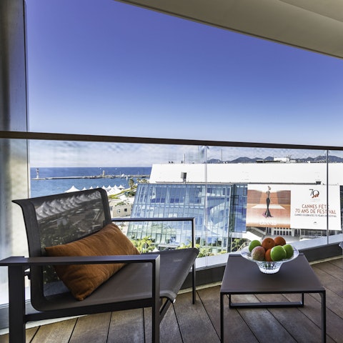 Sip local rosé while looking out at Palais des Festivals