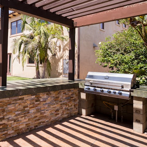 Cook up some American style burgers at the outdoor kitchen barbecue area
