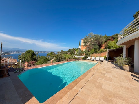Cool off in the pool surrounded by lush Mediterranean gardens