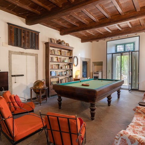 Gather in the old-world games room for a round of billiards