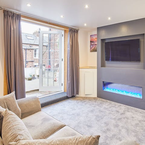 Watch the electric fire flicker from your snuggly spot on the sofa