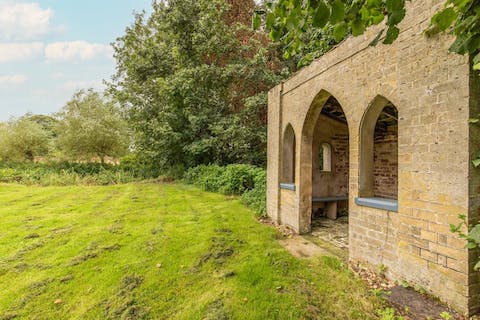 Find some peace and quiet in the traditional folly at the edge of the garden