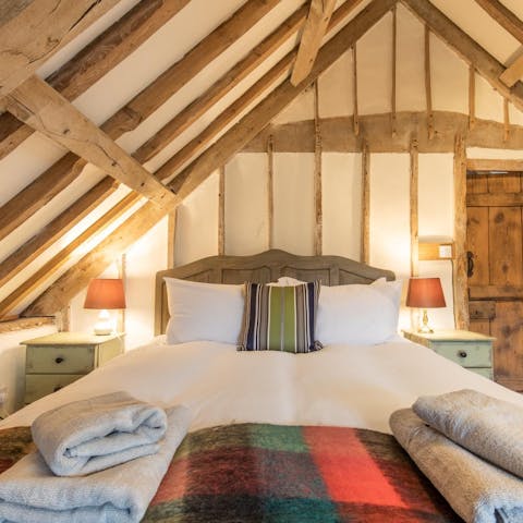 Fall asleep under characterful timber beams in the loft bedroom