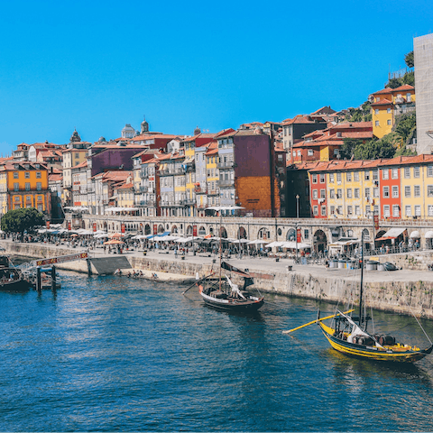 Head down to Cais da Ribeira and enjoy a coffee by the water