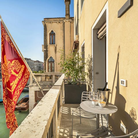 Watch the world go by from the canal-side balcony