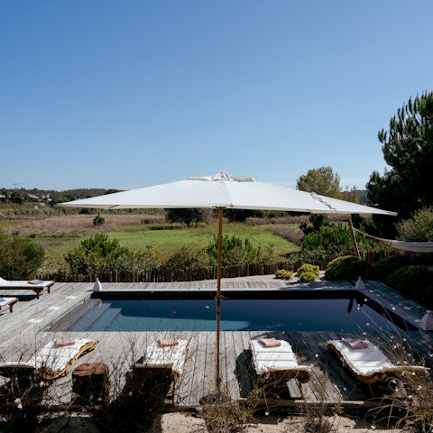 Lounge by the pool with a view