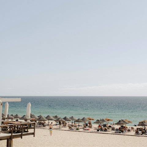 Head to the sandy beach, just a five-minute drive away