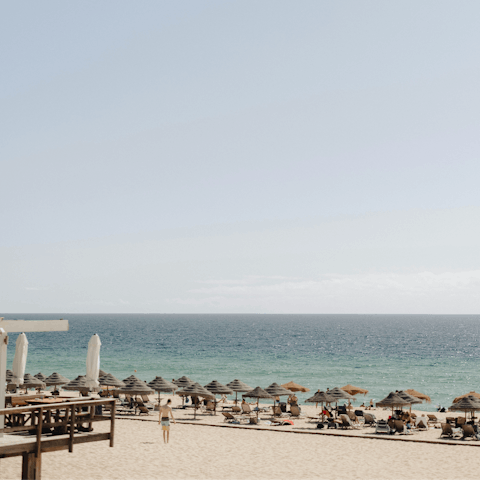 Head to the sandy beach, just a five-minute drive away