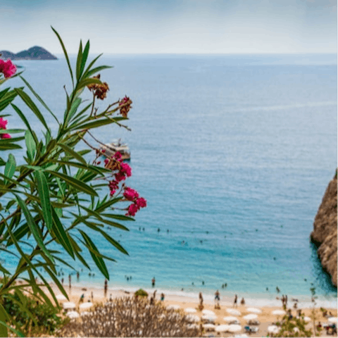 Spend the day at the beach club, a short walk away