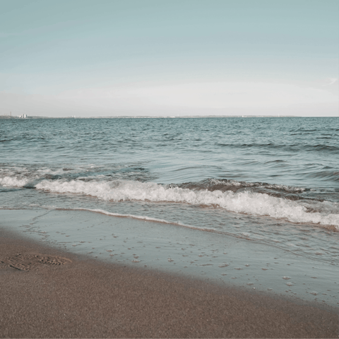 Find the nearest sandy beach just over a mile away