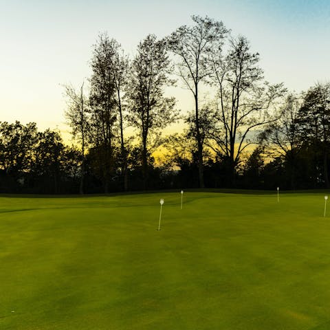 Practice your swing and tee off the resort's golf course