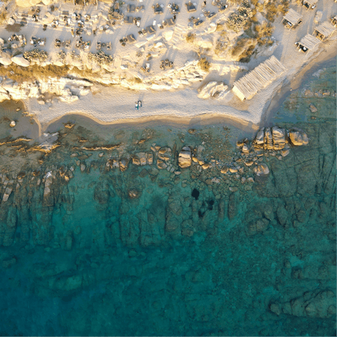Soak up the magic of Mykonos from Ornos Beach