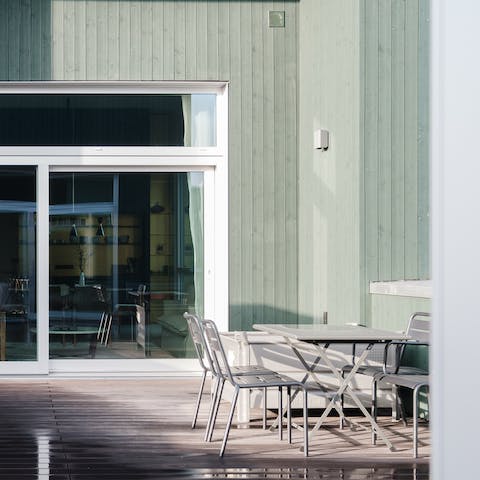 Relax on the private rooftop balcony with a glass of wine in one hand and a good book in the other