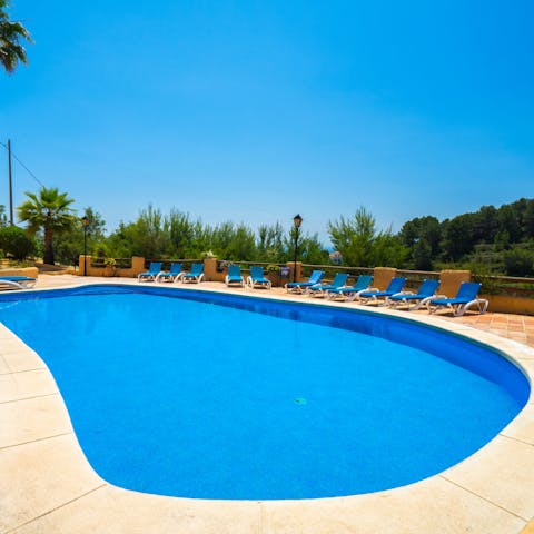Take a dip in the glistening swimming pool