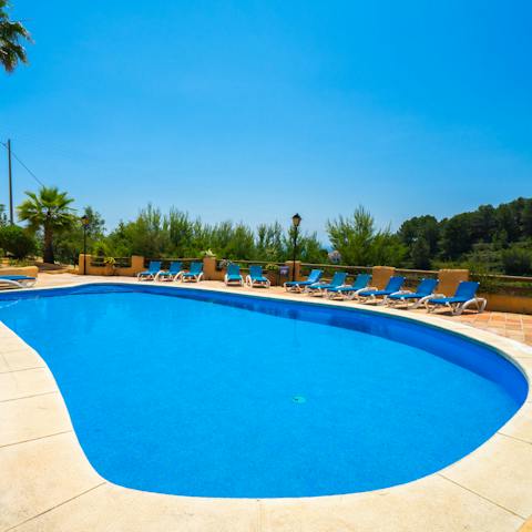 Take a dip in the glistening swimming pool