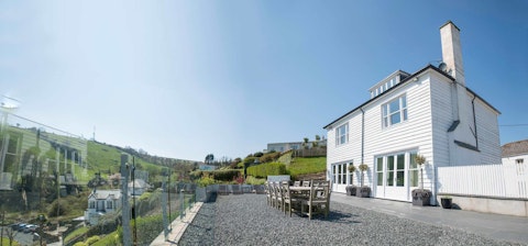 Dine alfresco with rolling green hills as your backdrop