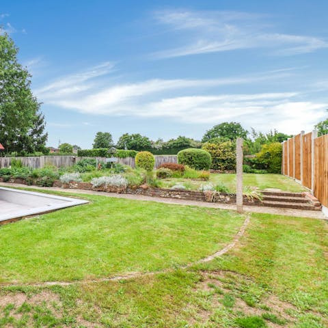 Enjoy the wide-open garden, perfect for picnics or playing with the kids