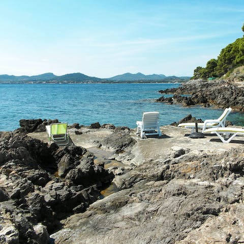 Sunbathe between taking dips in the sea with private access to Cap d'es Pinar