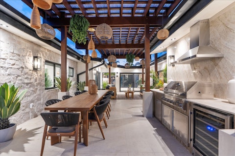 Fire up the barbecue and relax with drinks under the pergola
