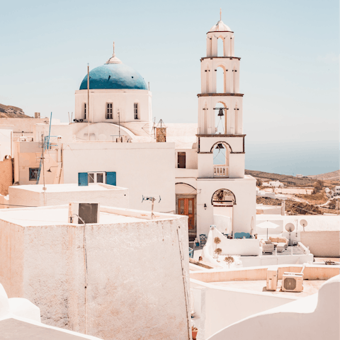 Explore the narrow lanes of nearby Pyrgos and people-watch in its main square