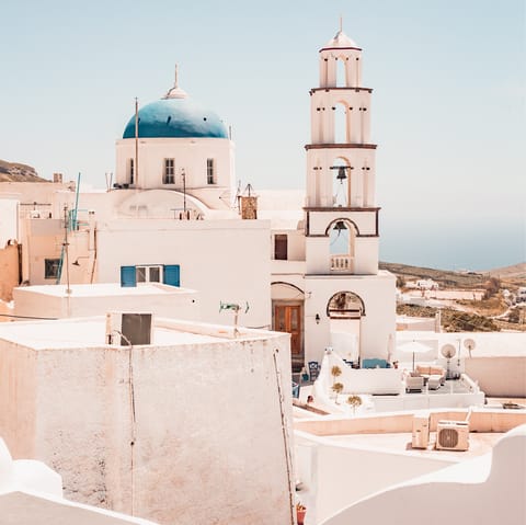 Explore the narrow lanes of nearby Pyrgos and people-watch in its main square