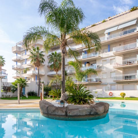 Enjoy a refreshing dip in the shared swimming pool