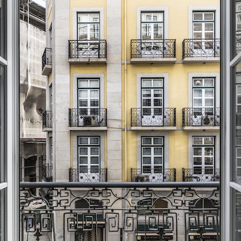 Step out onto the traditional narrow balcony for some fresh air with your morning coffee