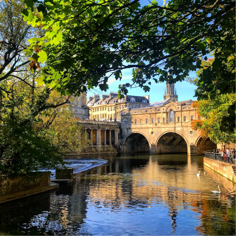 Explore Georgian Bath, including the Roman Baths situated right opposite this home