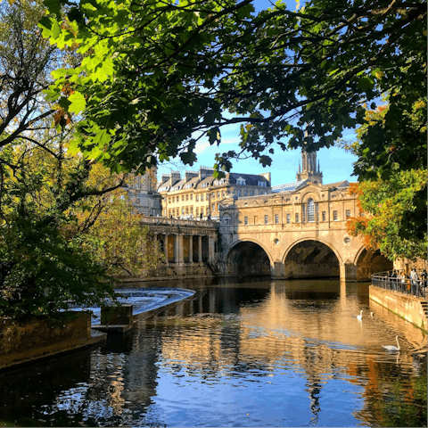 Explore Georgian Bath, including the Roman Baths situated right opposite this home