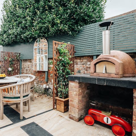 Throw some pizzas in the pizza oven and dine alfresco