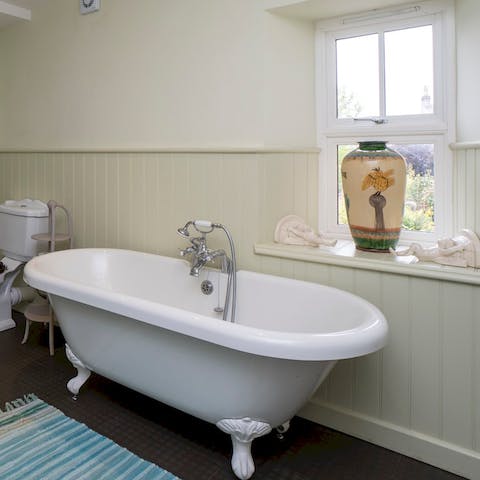 Have a pamper session in the roll top bathtub