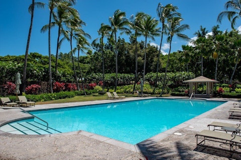 Cool off in the sparkling shared pool tucked among tropical palms
