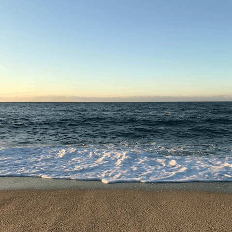 Feel the sand beneath your feet at Mar Bella beach