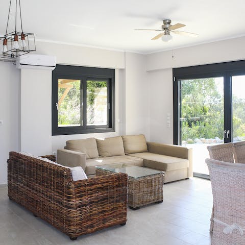 Settle down in the breezy living room after a long day discovering Nydri