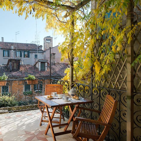 Take in the vistas over the bell tower of the church of San Giacomo dell'Orio from your private terrace