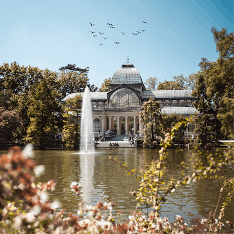 Marvel at the beautiful El Retiro Park, a walk or train ride away