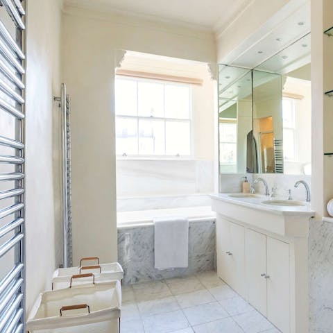 Pamper yourself and enjoy a long, hot bath in the luxurious bathroom