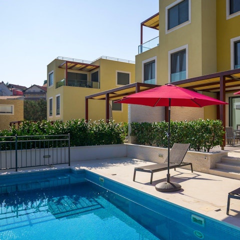 Lounge by the pool on a hot day