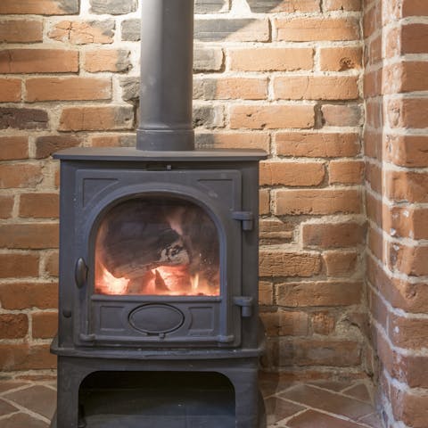 Snuggle up with a glass of wine and a good book in front of the wood-burning fire