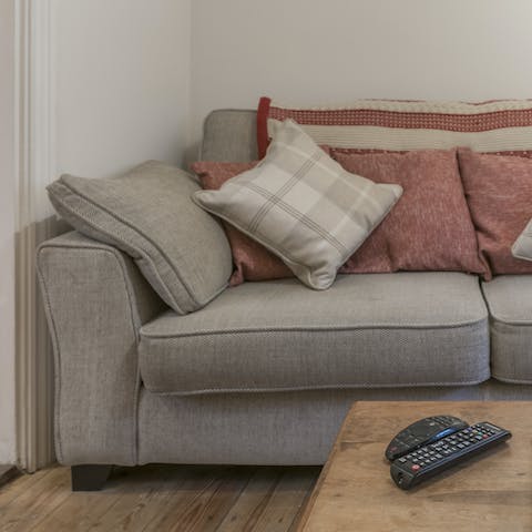 Stretch out on the plush sofa after a long walk through the countryside