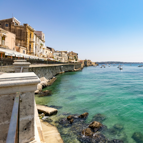 Drive to the historic square of Largo Aretusa, twenty-five minutes away