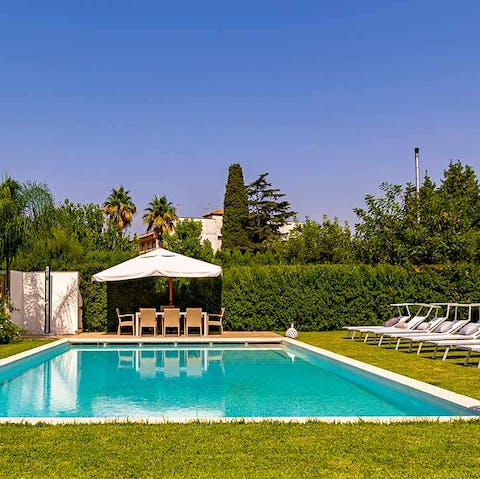 Soak up the sun by the glistening pool